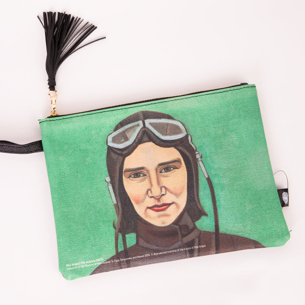 A clutch bag featuring the Rita Angus artwork 'Aviatrix' with a black tassel 