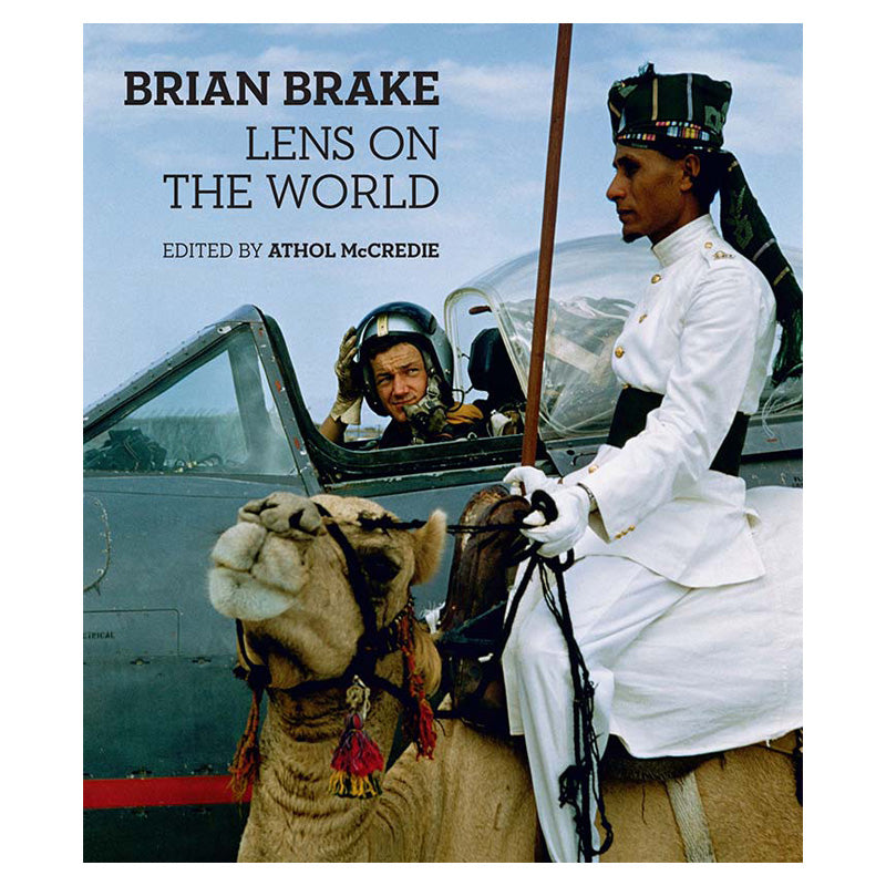 Front cover featuring a photograph of a man astride a camel in front of a pilot in an aircraft